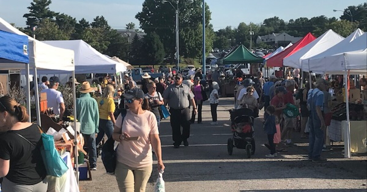 Shoppers browsing a farmers market in Bloomington, Indiana